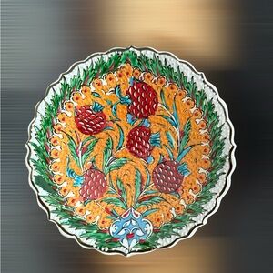 Vibrant Ceramic Plate with Orange and Green Design